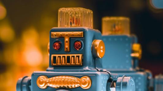 Close up photo of a metallic blue robot toy.